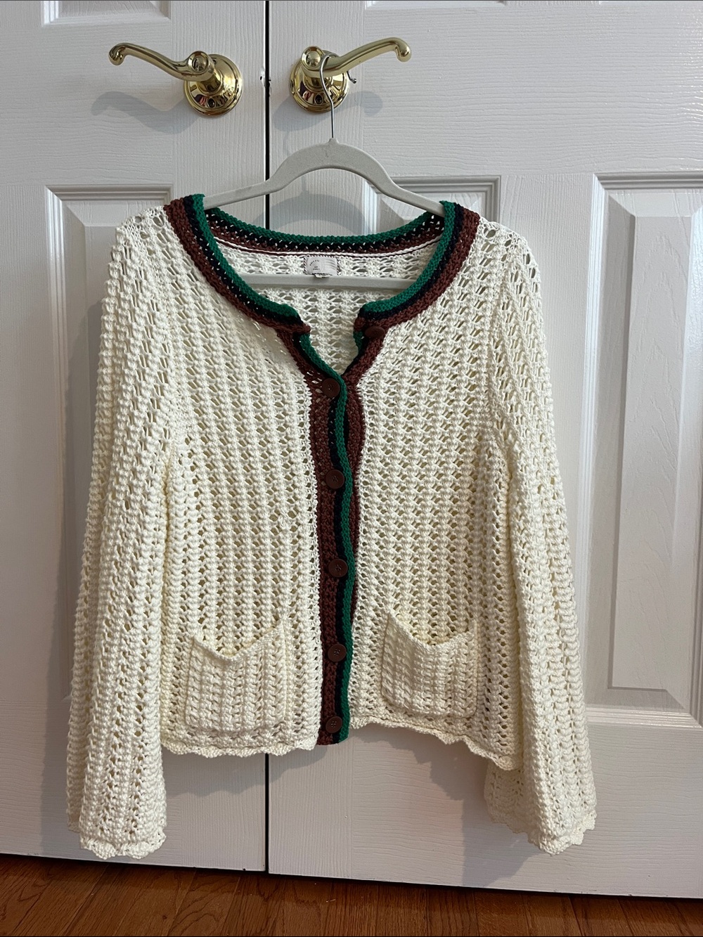 Size S white crochet cardigan with brown and green trim from Anthropologie